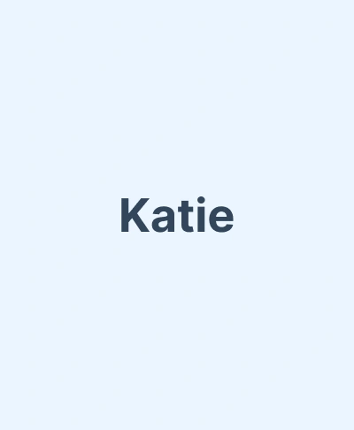 Katie, staff member at Gila Ridge Dental, displayed on light blue background.