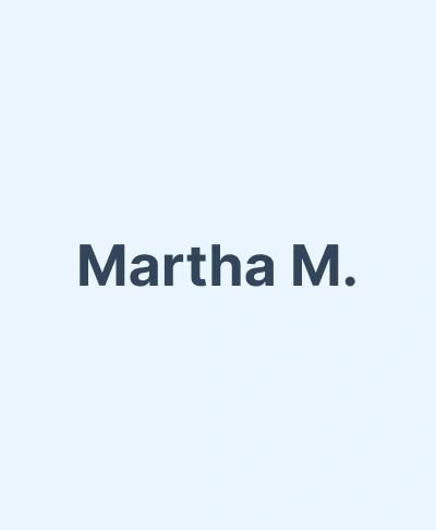 Name text "Martha M." displayed on light blue background for dental website profile.