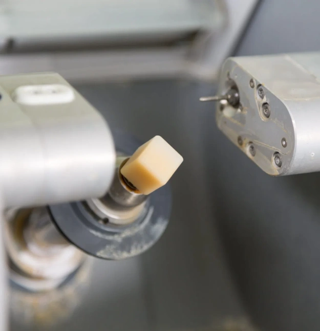 Dental implant component displayed on dental equipment in clinical setting at Gila Ridge Dental office.