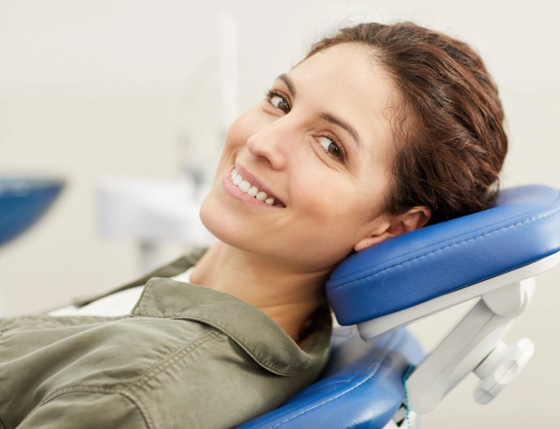 Happy female patient relaxing in dental chair at Gila Ridge Dental office